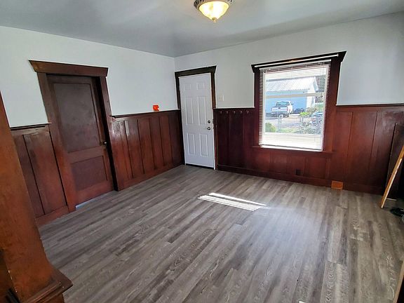 Living room, looking toward street. Entry to front bedroom on left.