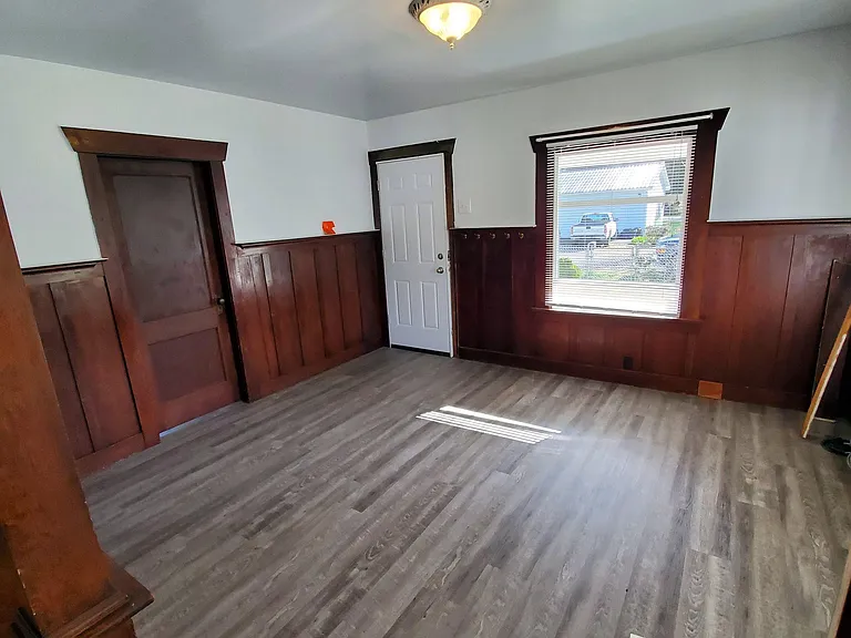 Living room, looking toward street. Entry to front bedroom on left.