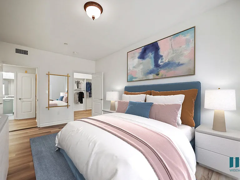 Bedroom with Walk-In Closet with Built-In Organizers and Bathroom