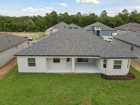Joyce new construction quick move-in home 879 Tierra Dr. rear exterior view at Whiting Estates Sprin