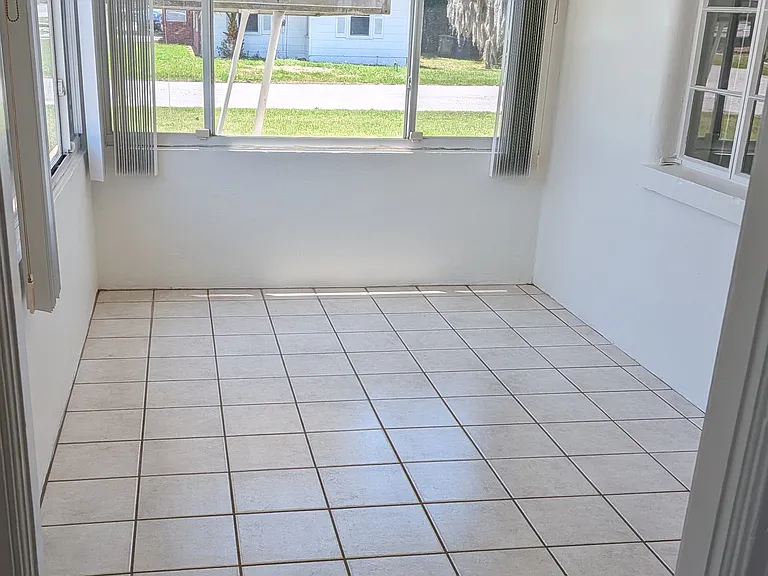 When you enter the front door you enter a sunroom. This bright and flexible space could be perfect for a home office, studio, gym, or dining area.