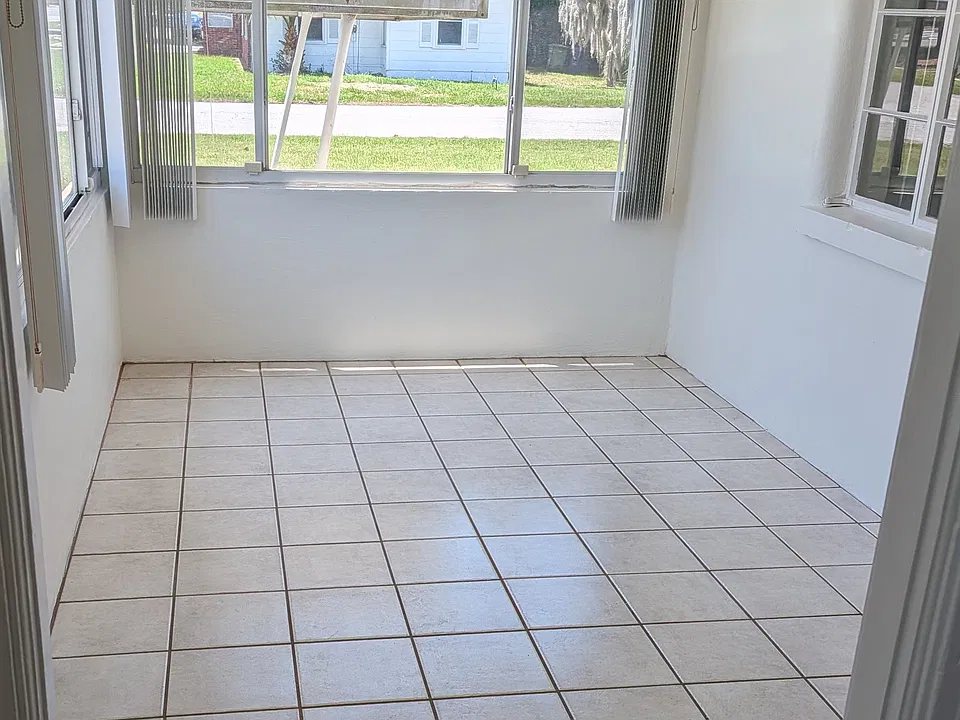 When you enter the front door you enter a sunroom. This bright and flexible space could be perfect for a home office, studio, gym, or dining area.