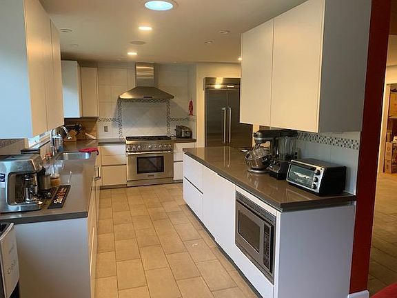 Large kitchen with Thermador appliances. Lots of counter and cabinet space.