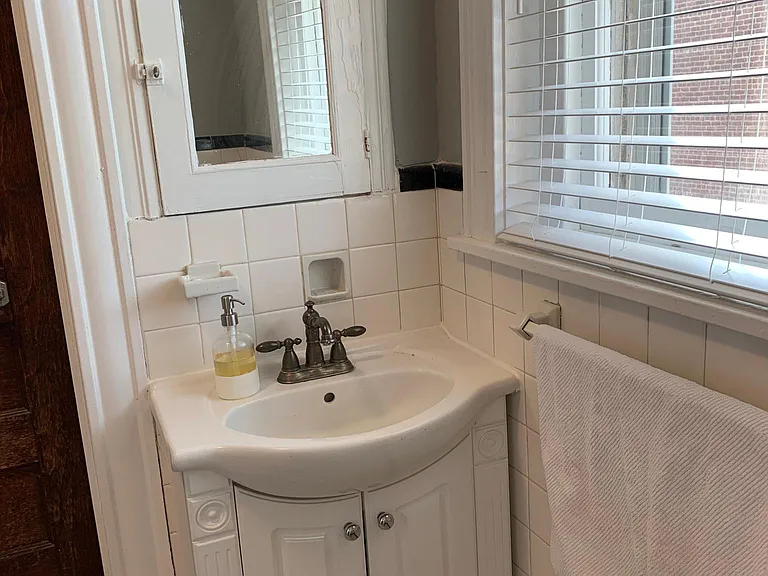 Full bath with tub servicing bedrooms 2 and 3 and common living space