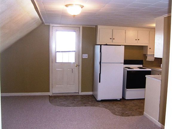Inside living room facing kitchen