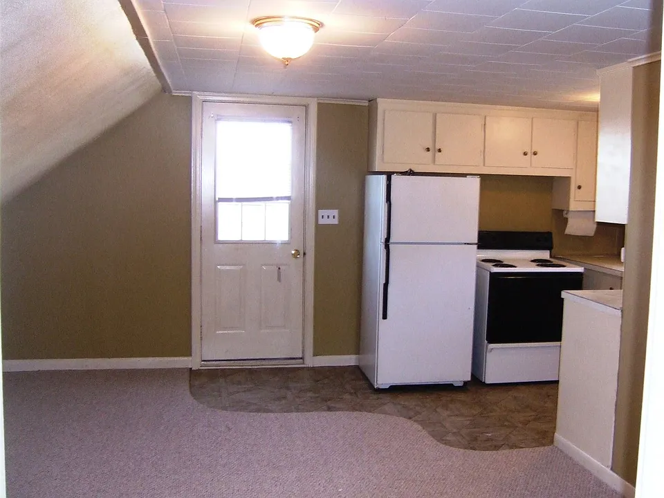 Inside living room facing kitchen