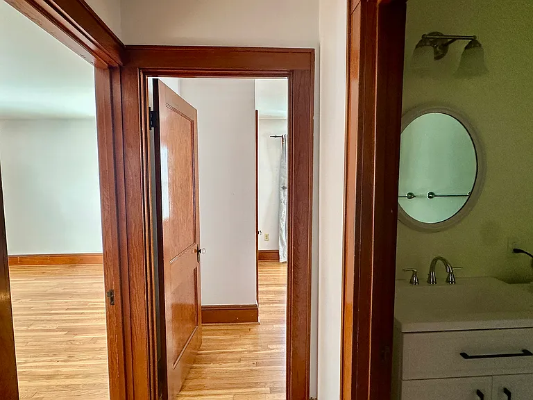 Hallway view showing location of bathroom and both bedrooms