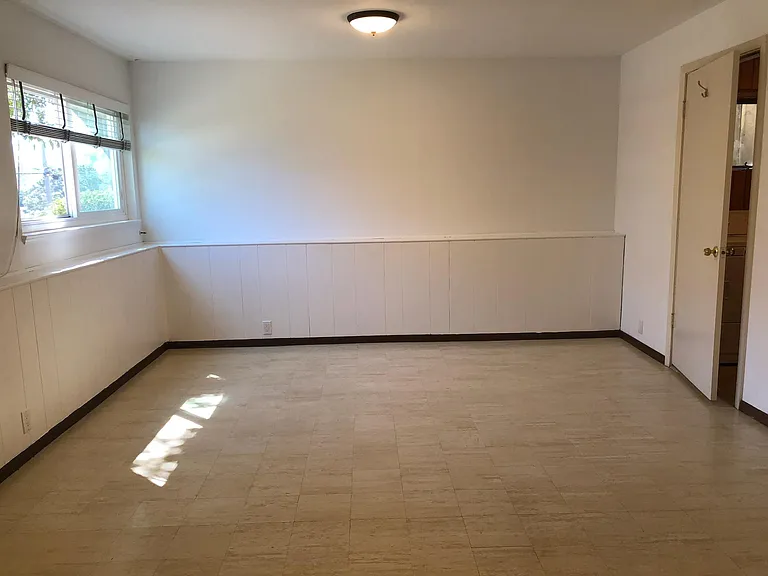 downstairs' room with laundry room on the right hand side