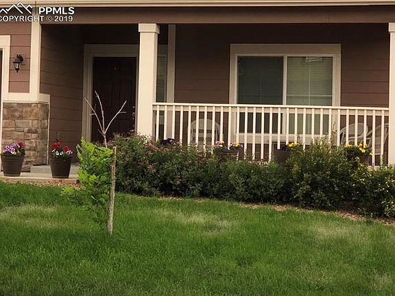 Large covered front porch has plenty of room for table and chairs or glider swing.