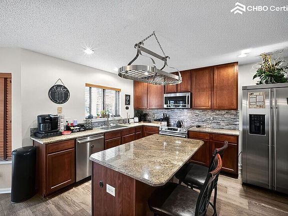 Large island with storage space underneath and stools