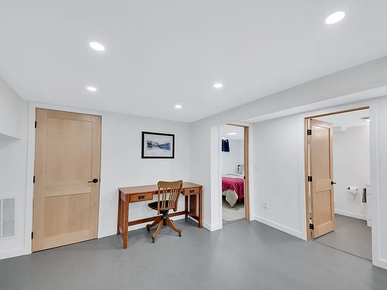 Lower level office area with desk and chair.