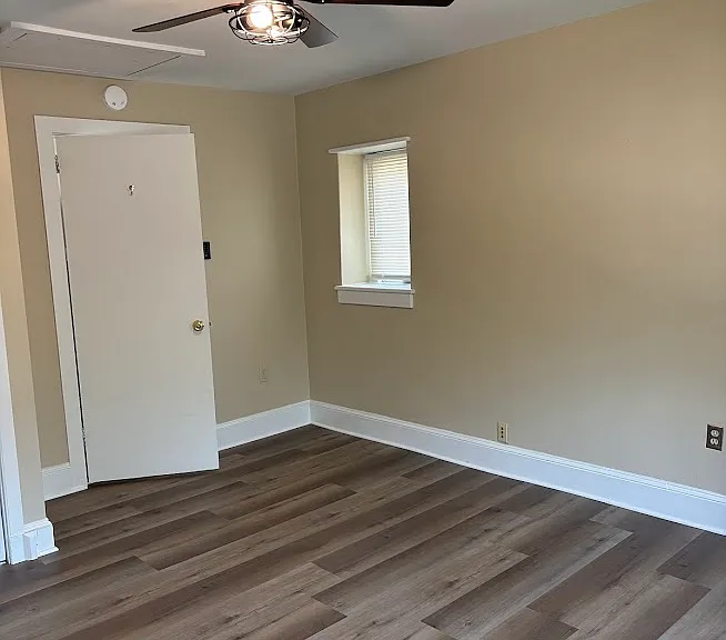 North Bedroom-Ceiling Fan, Door, Montgomery Ave. facing Window.