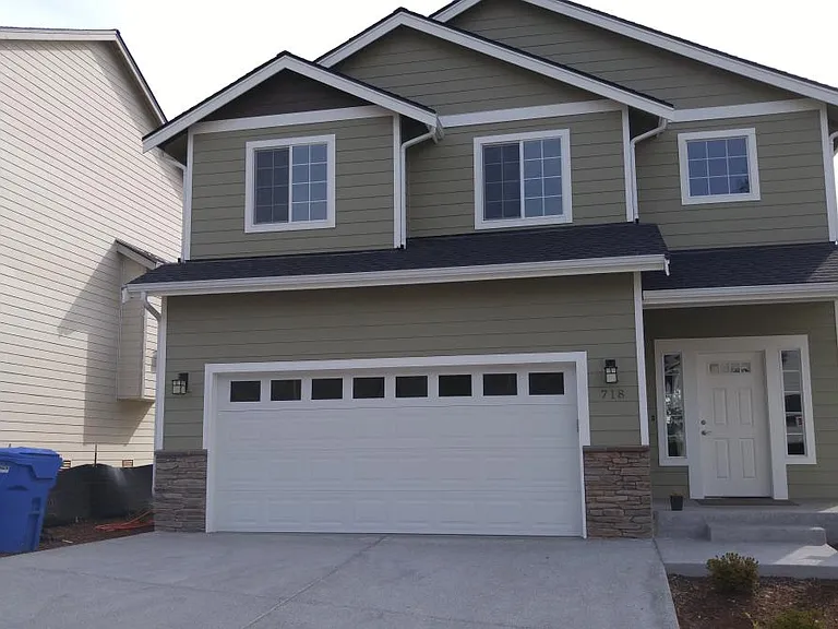2 Car Garage, fits Toyota Highlander and other similar size SUVs. Full Size Trucks will NOT FIT. Driveway medium sized , but not suited for long Vehicles.. Garage has extra storage with Safe Racks type of a Ceiling hung system.