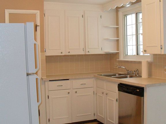 Kitchen has white wood cabinets & all appliances incl.