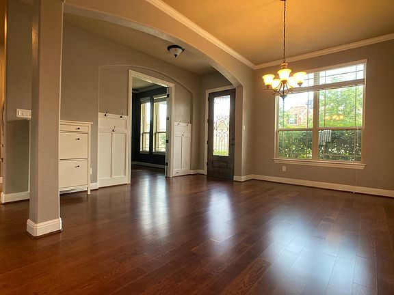 front entry and formal dining area. background entry to office