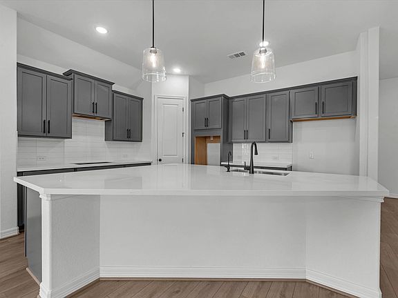 Kitchen. Sample product photo. Actual exterior and interior selections may vary by homesite. Photo m