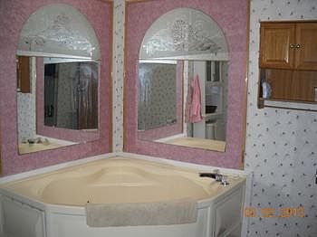 Being there are sooo many bedrooms. Here is a partial view of the masterbathroom, after a hard day at work why not come relax. PLUS the master bedroom is at the opposite end of the home from the other rooms.