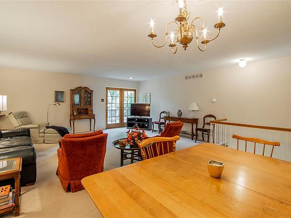 Spacious, open, dining room/ living room combo with access to the large deck.