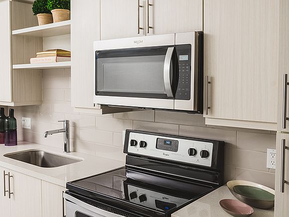 Custom cabinetry and stainless steel appliances