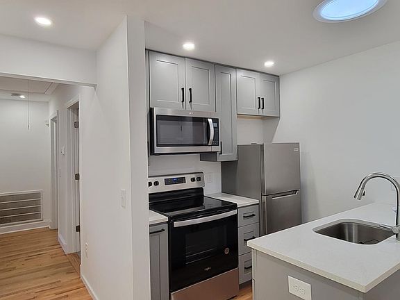 kitchen and hallway to bedrooms and bathroom