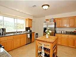 Newer Remodeled Kitchen with Granite Counters and Oak Cabinets