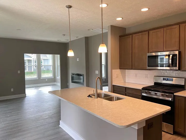 Kitchen look out to family room, master bedroom, sun room