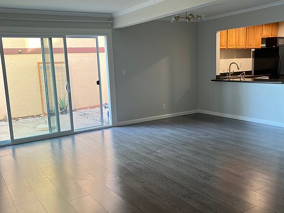 Open format living room and dining area. Lots of natural light and good air