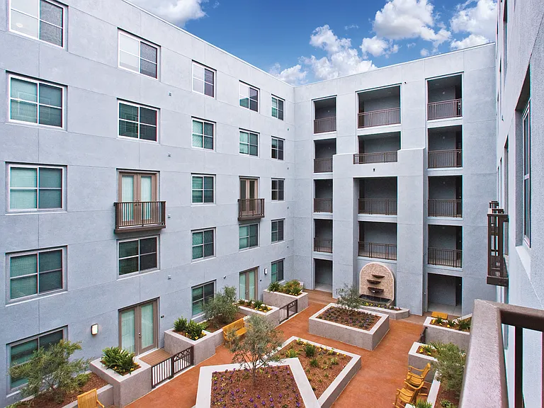 5 beautiful courtyards with water features, lush landscaping and outdoor lounge seating