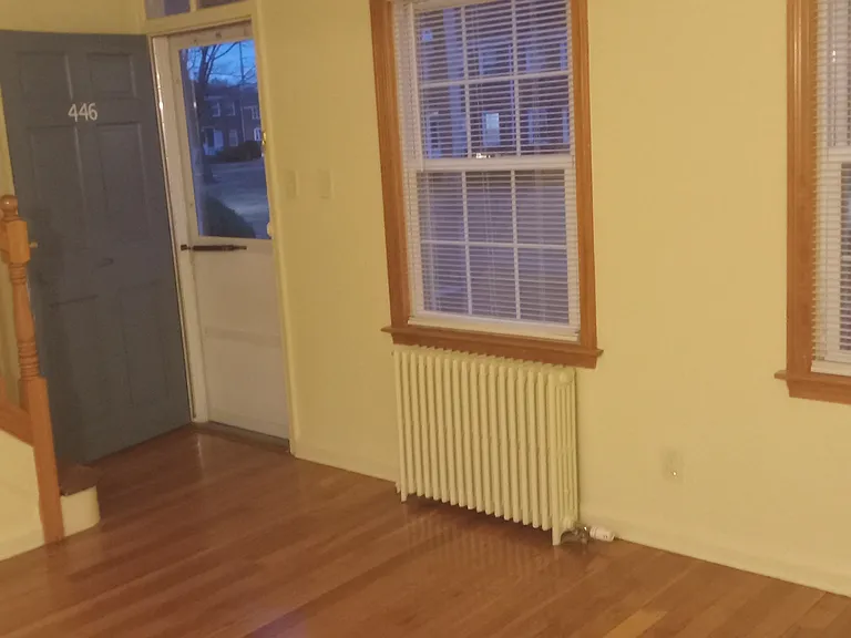 View of living room, front door and stairs to 2nd floor