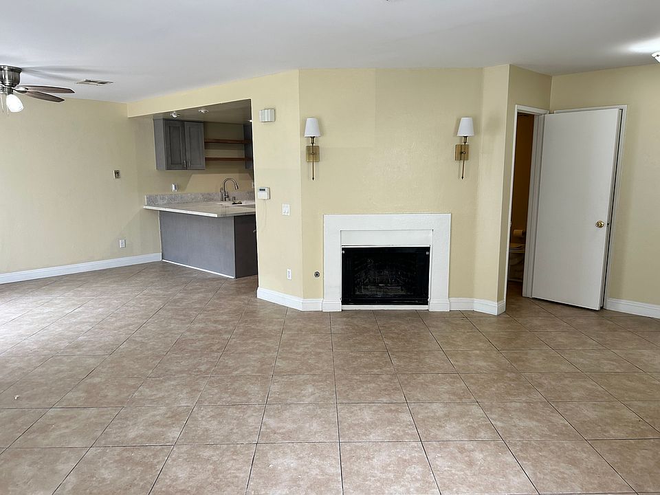 View of open space of kitchen and living area.
