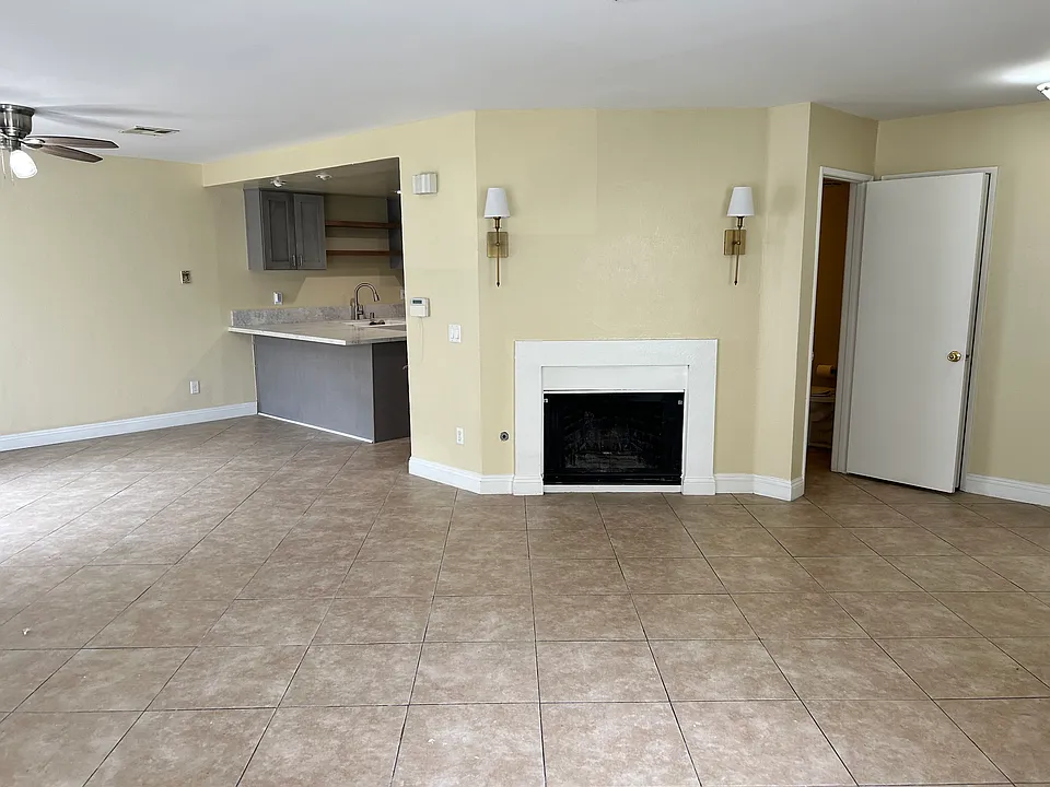 View of open space of kitchen and living area.