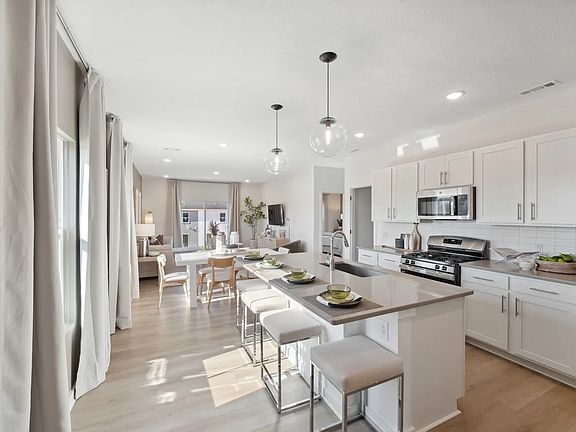 Kitchen with island and pendant lighting
