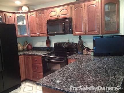 Upgraded kitchen
						:
						Solid Cherry cabinets & Granite counters.