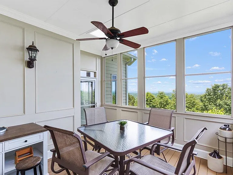 Screened in porch off the kitchen