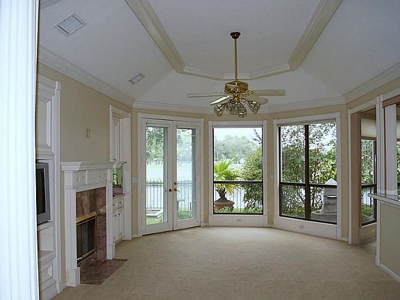 Spacious living area with breathtaking views of the 9th hole.