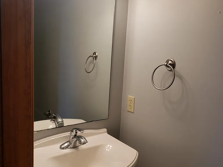 Half bathroom located by the front door entrance