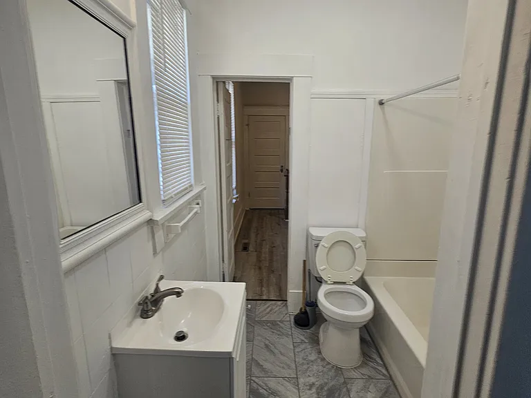 Bathroom has two entrances. One entrance from bedroom/dining room and the other entrance is from the additional study/living room.