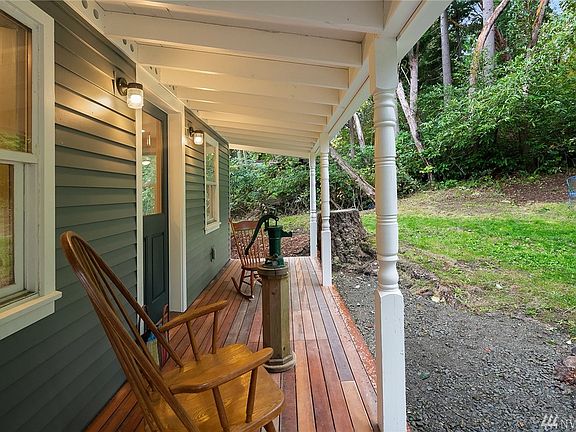 Covered, welcoming entry deck. Coffee rain or shine!