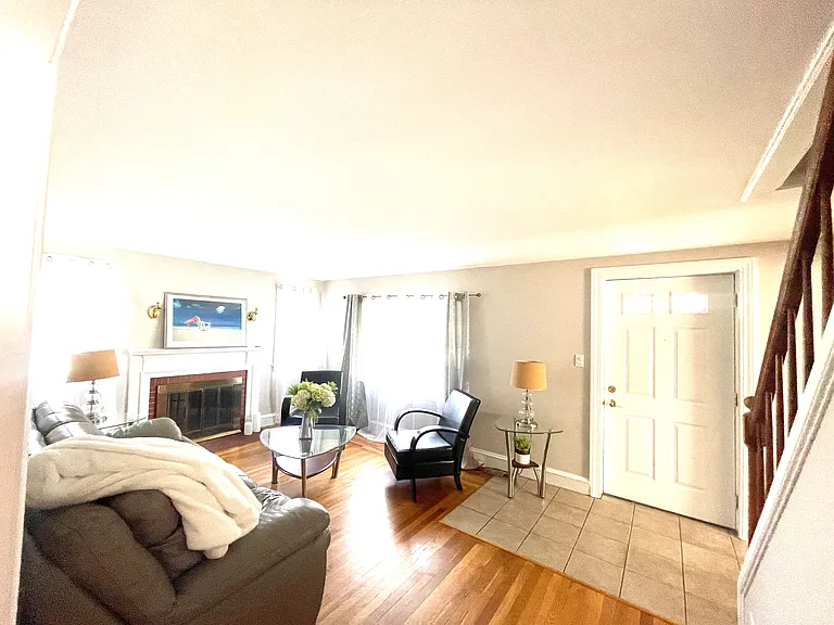 living room, it can accommodate a TV stand and small foot bench.