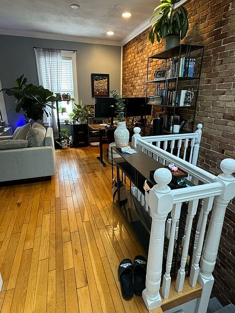 Living room including open stairs