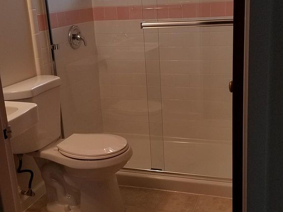 new shower using 1950's pink and green tile from the original house