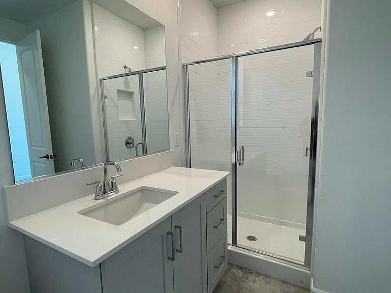 Walk-in shower with utility