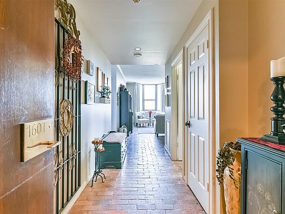 Entry to this corner unit located on the 16th floor of Woodway Place ll.