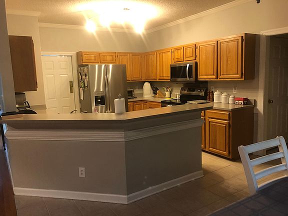 Kitchen with new stainless steel appliances in August 2019