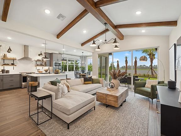 Great room with stained ceiling beams and vaulted ceiling