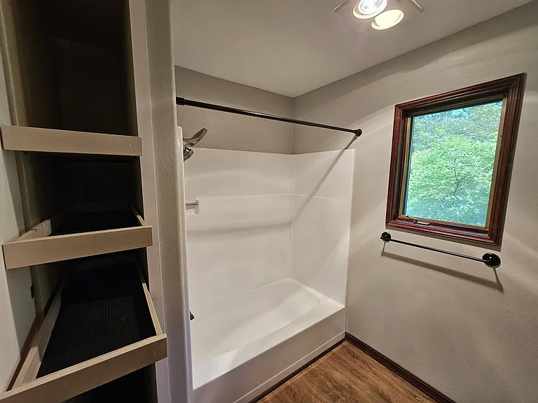 Second level full bath with sliding drawers to maximize functionality.