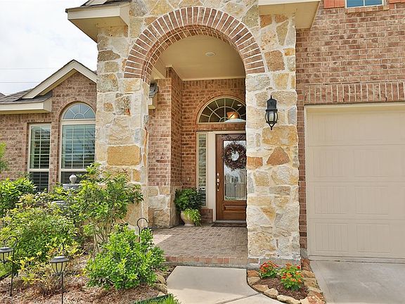 Inviting front porch with stone elevation.