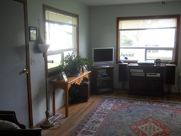 Living room features two large, new windows.