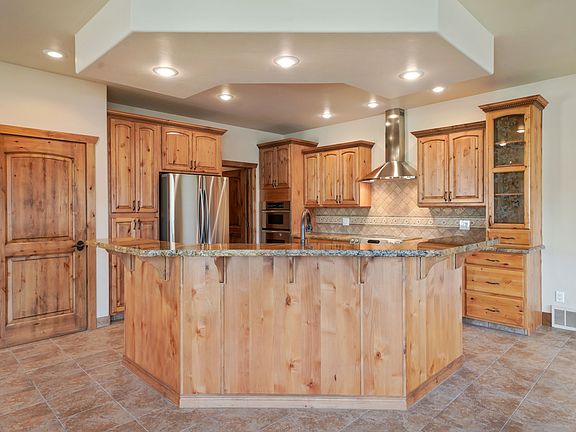 Beautiful kitchen, double ovens, stainless steel appliances.