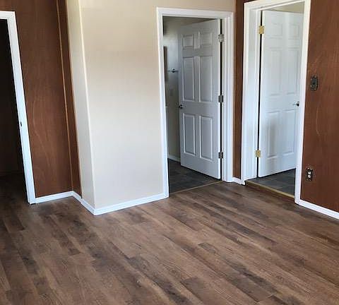 Bedoom 1, looking at doors of walk-in closet, bath, kitchen